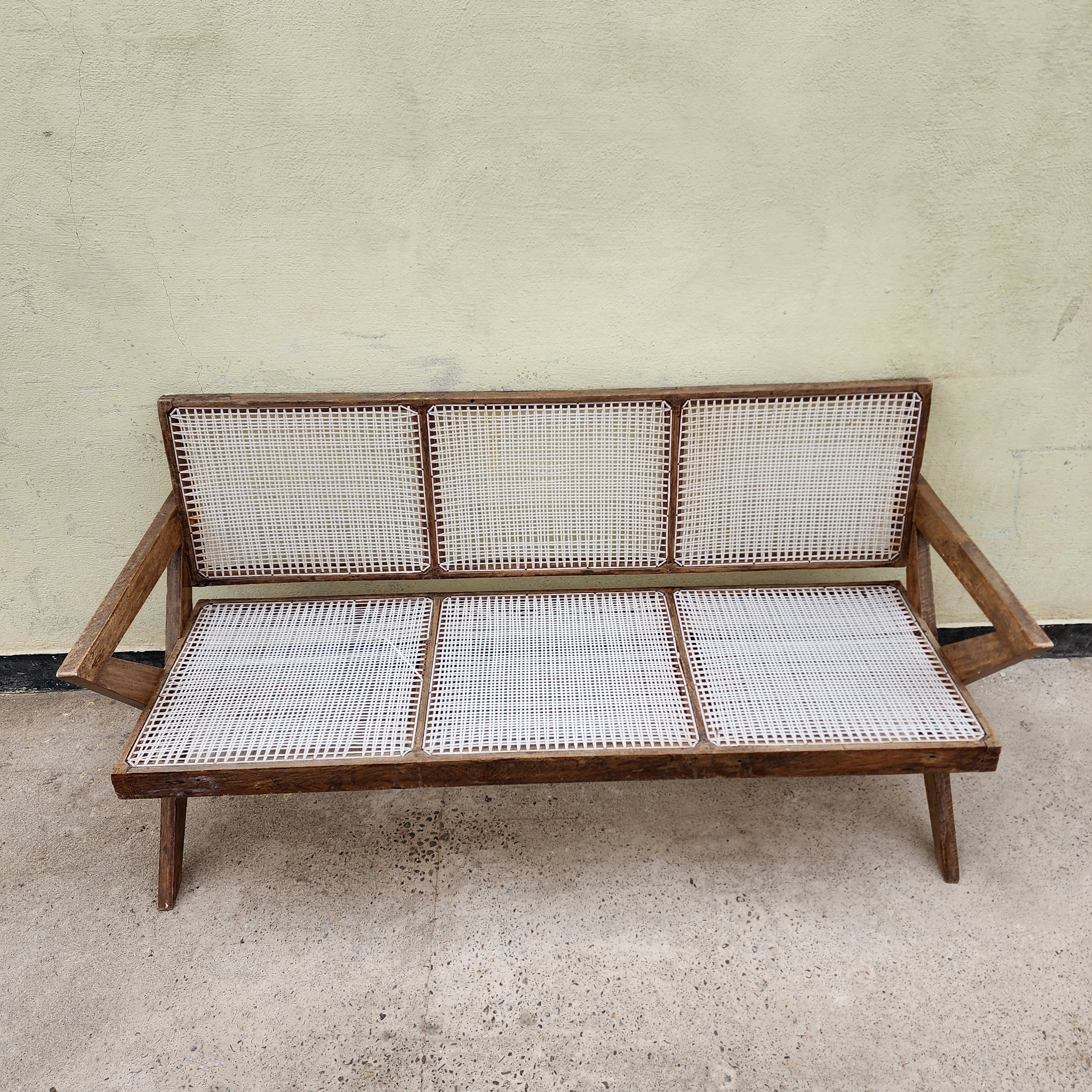 Cross leg cane sofa